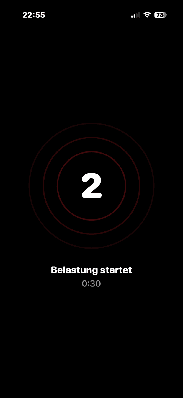 Die drei Sekunden vor dem Start: eine große 2 in konzentrischen Ringen und der Hinweis „Belastung startet“.